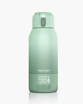 Momcozy mint green portable milk warmer, LCD display, 98°F, perfect for travel and fast milk heating.